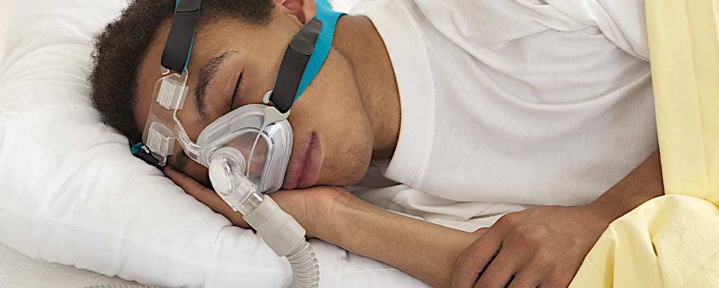 a man uses a cpap after being diagnosed with sleep apnea