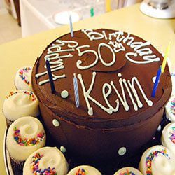 a birthday cake indicates five dental issues for people over 50